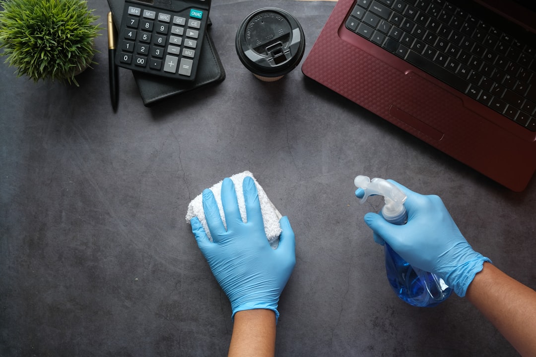 services-bg person-in-blue-long-sleeve-shirt-sitting-beside-black-laptop-computer-9gpkrsbgmc